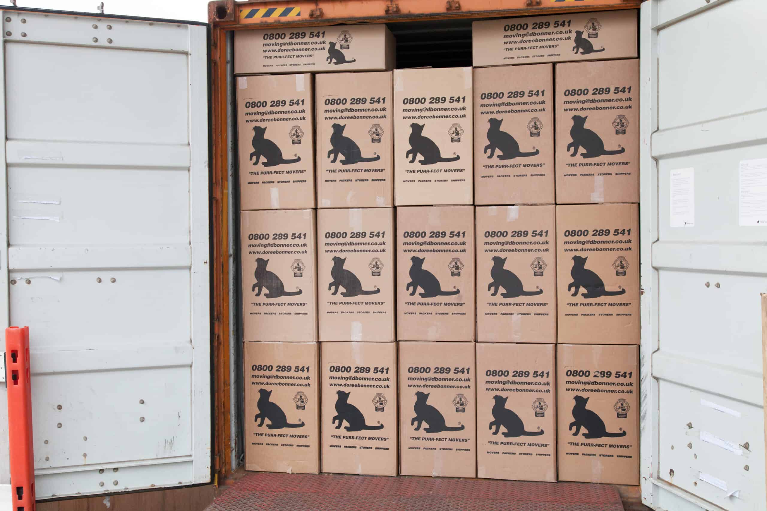 Doree Bonner branded boxes in an open shipping container